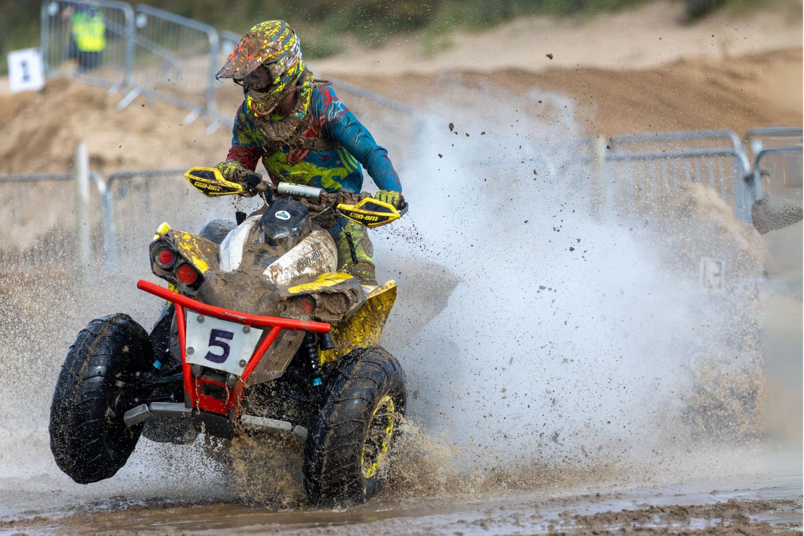 A quad bike kicks up a sea of spray behind it during the Weston-super-Mare Beach Race
